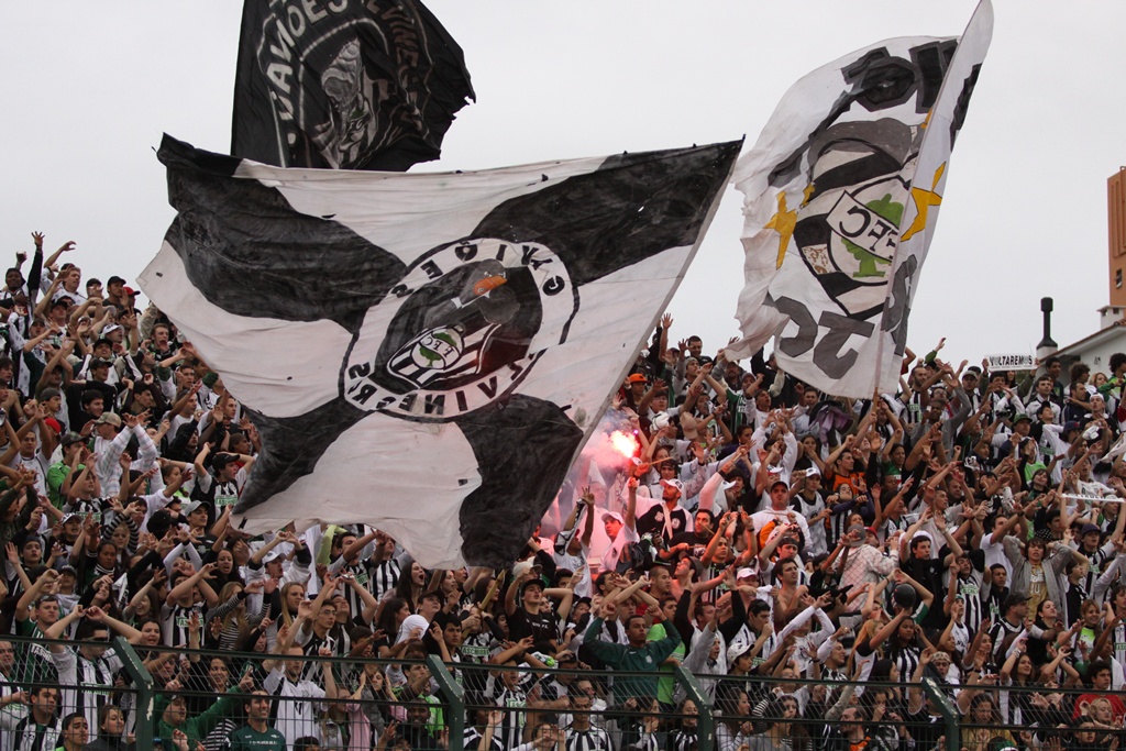 Crowd with flags and smoke